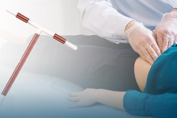 Doctor performing an examination of a woman's abdomen.