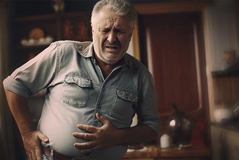 An AI-generated image of a man holding his abdomen in distress